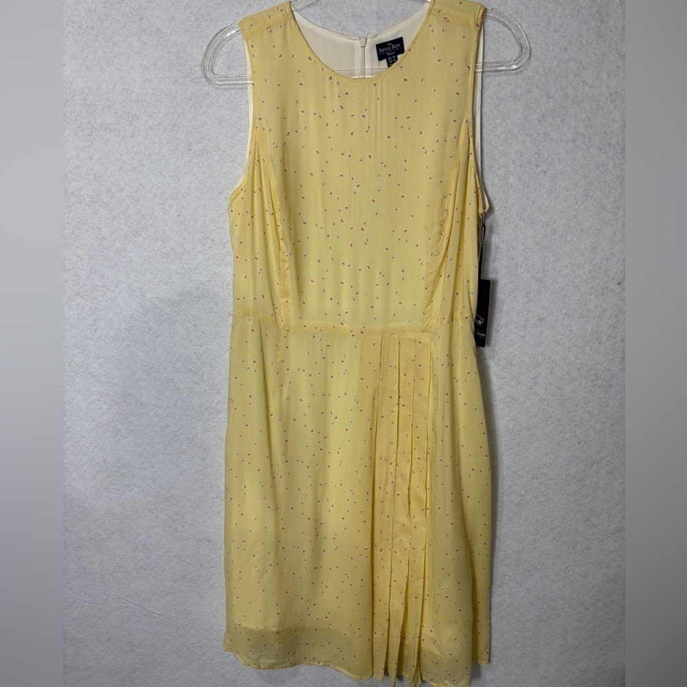 The Savile Row Dress This is a beautiful yellow dress with small print.